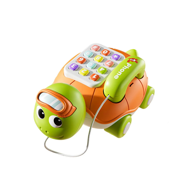 A green musical turtle crawling toy with a phone attached, designed for babies.