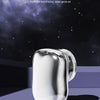 A silver compact USB rechargeable travel shaver resting on a purple surface with a soft shadow.