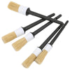 A set of three black and white detailing brushes for cleaning interior and exterior surfaces.