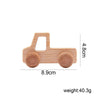 A light wood hand-pushed cart toy for toddlers with rounded wheels.