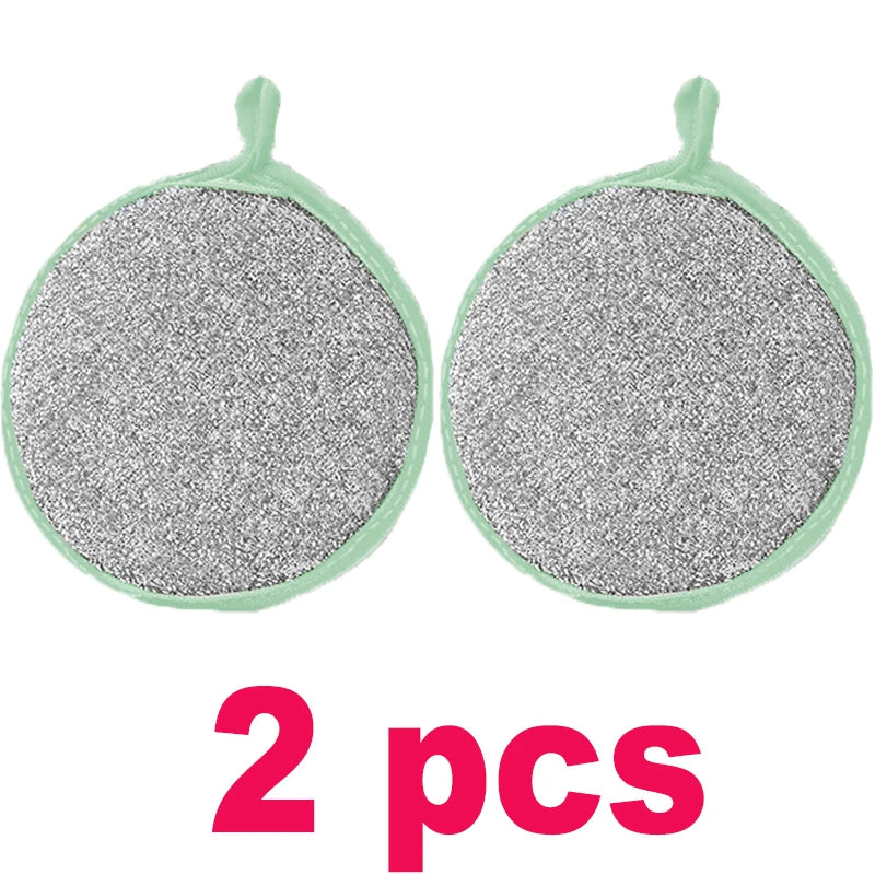 Two green silicone non-stick dish sponges with textured gray scouring pads