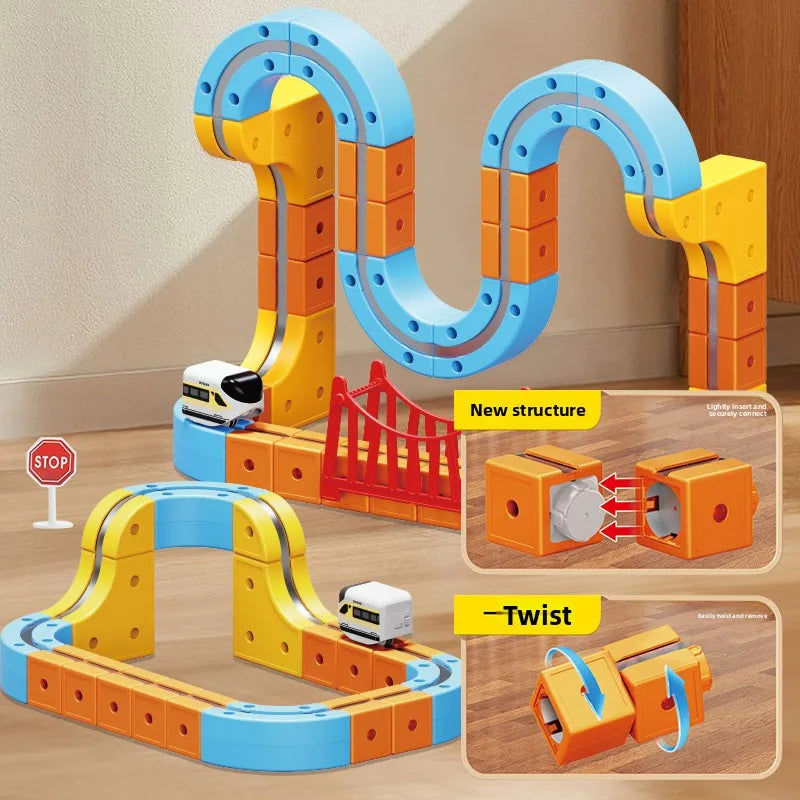 A set of magnetic train building blocks featuring a gravity maze structure in orange, yellow, and blue.