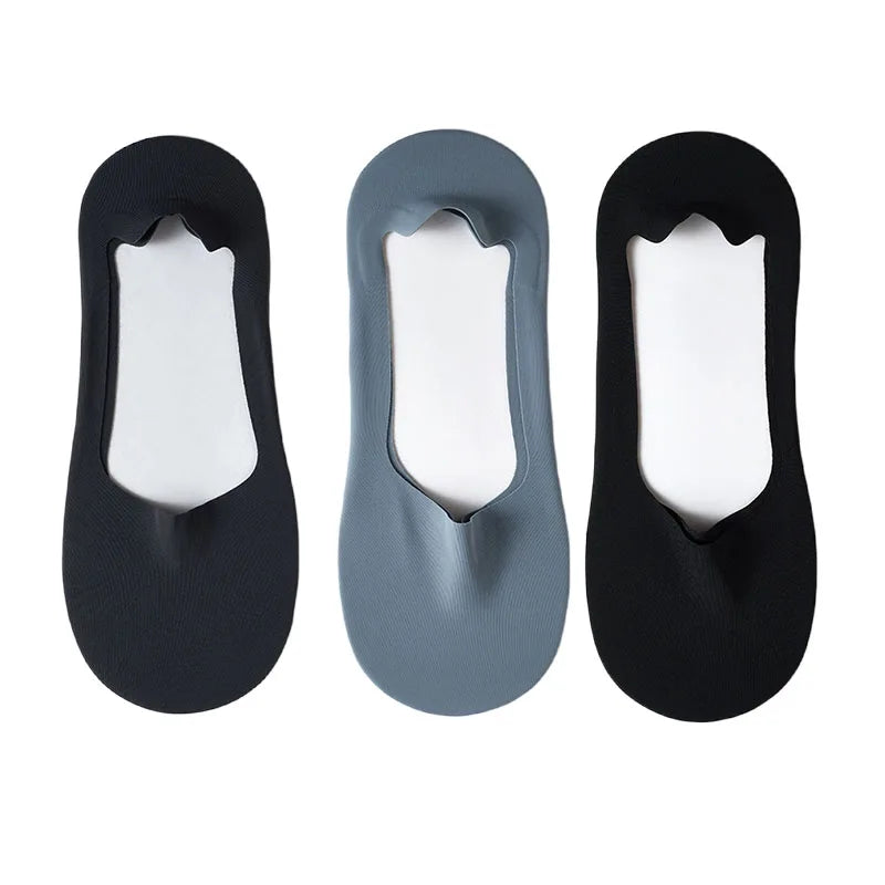 Three pairs of black and gray silicone grip no-show socks shown from the top view.