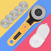 A yellow rotary fabric cutter with a black handle and a circular cutter blade is shown alongside several spare blades.