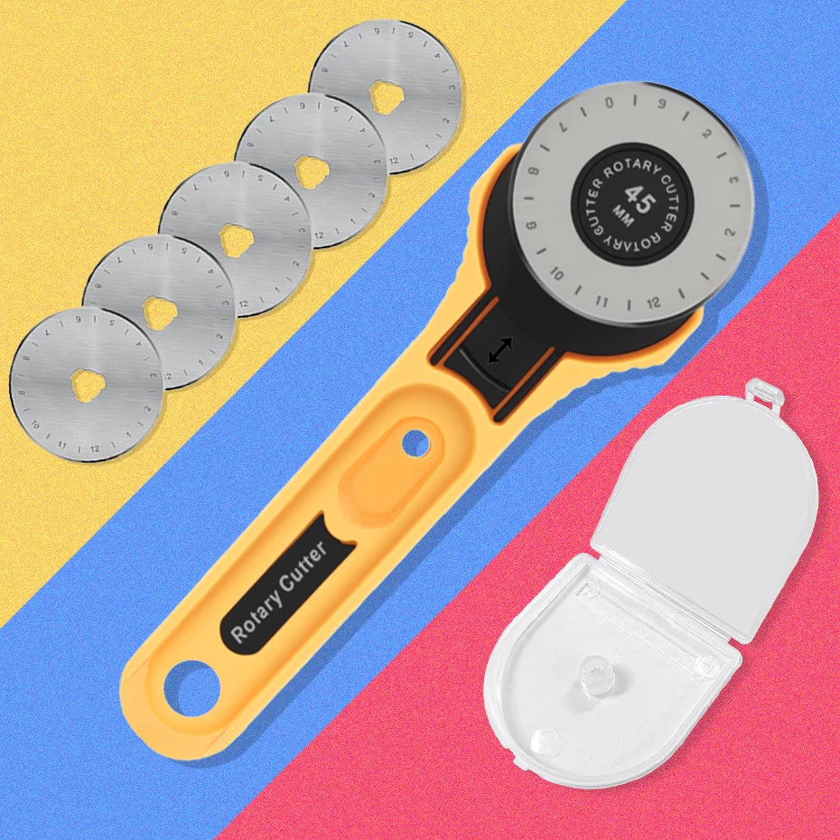 A yellow rotary fabric cutter with a black handle and a circular cutter blade is shown alongside several spare blades.