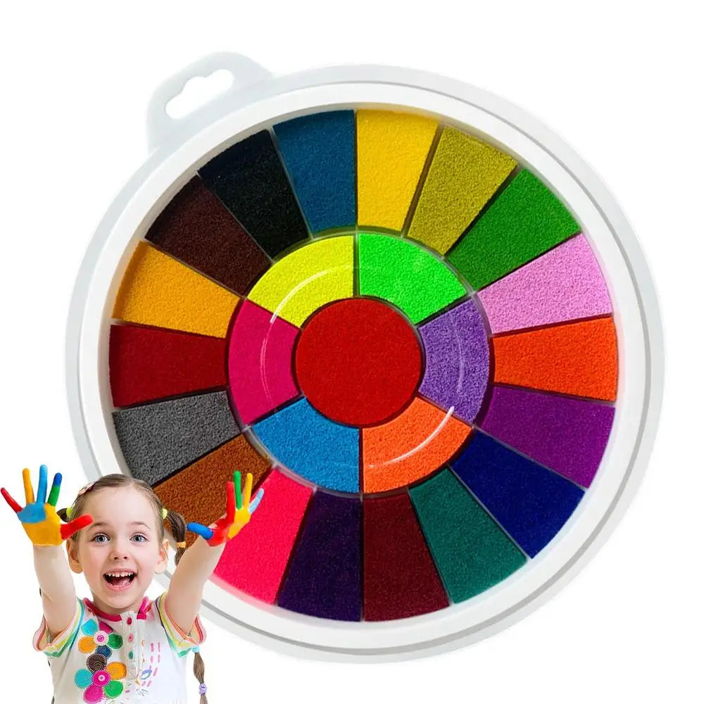 A child is holding colorful paint fingers above a circular color wheel for an educational activity.