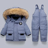 A light blue kids winter down coat featuring a natural fur collar and quilted design.