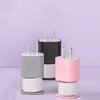 A set of silicone charger protectors and cable organizers in gray, black, and pink are displayed against a light purple backg