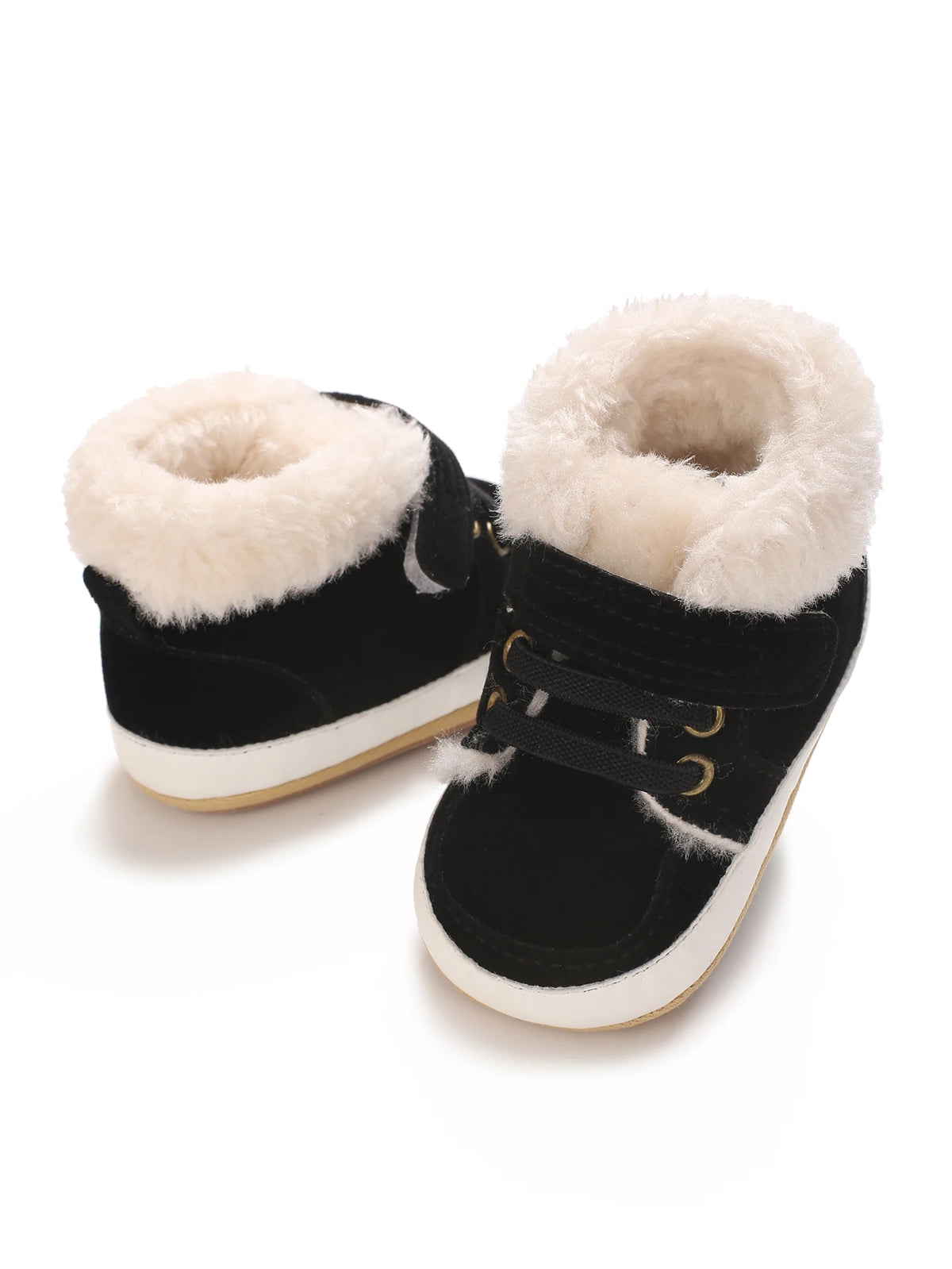 A pair of black baby winter snow boots with fluffy cream-colored faux fur trim.