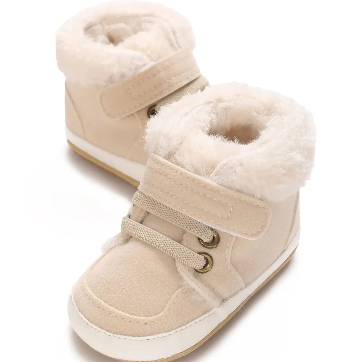 A pair of beige, fluffy faux fur baby winter snow boots for toddlers.