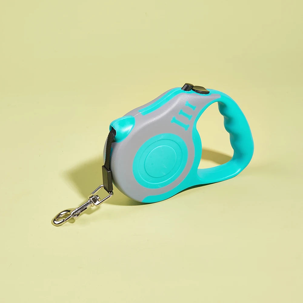 مقود كلب أوتوماتيكي قابل للسحب باللون الرمادي الفاتح والتركواز على خلفية صفراء باهتة