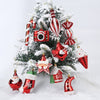 A festive Christmas tree decorated with red and white candy cane ornaments and baubles.