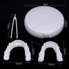 A white cosmetic denture teeth kit showing the full denture and individual teeth models.