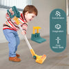 A young child is playing with a yellow and green interactive toy vacuum cleaner on a wooden floor.