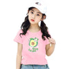 A young girl models a pink t-shirt with an avocado fruit print.