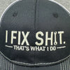 Black embroidered mechanic dad hat with white text that reads I FIX SHIT THAT'S WHAT I DO