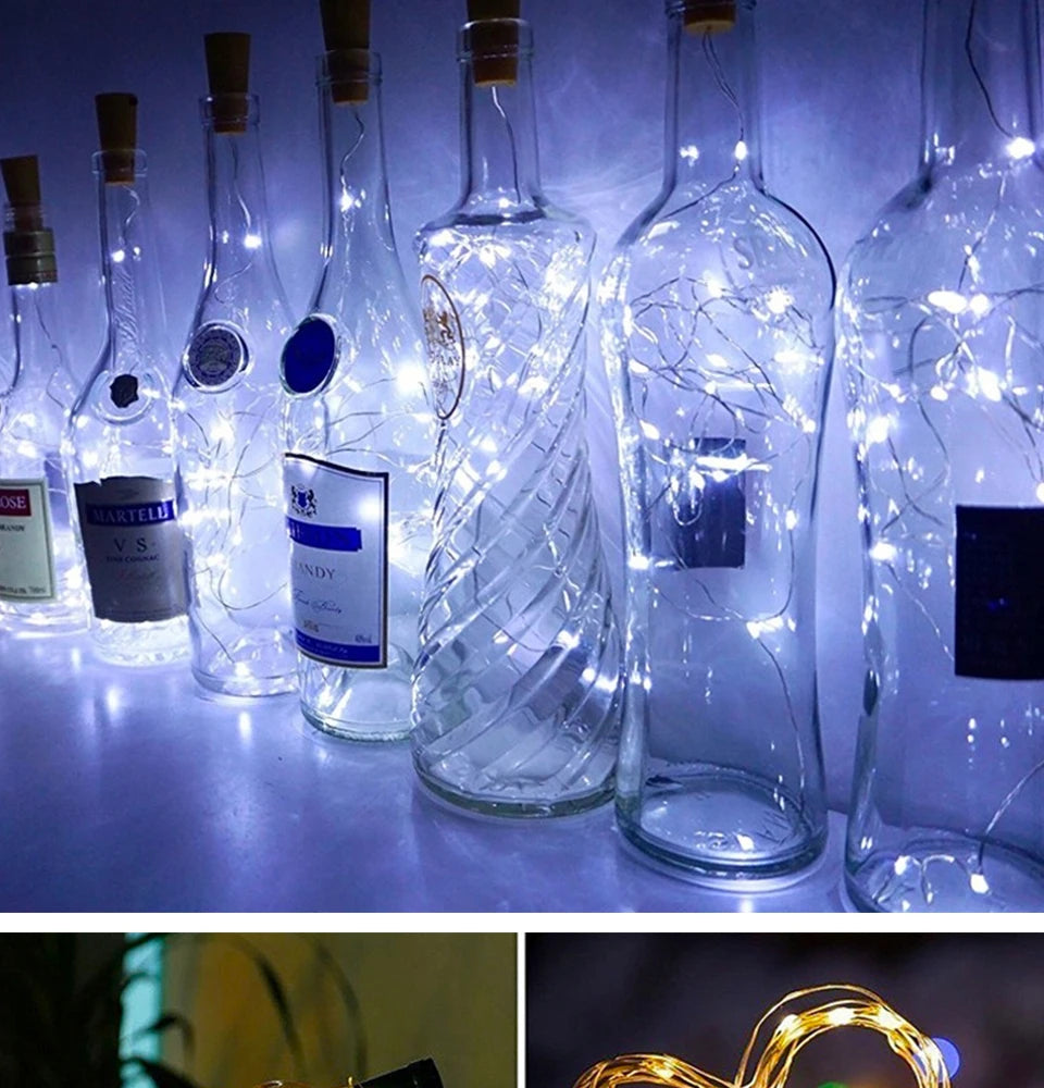 A row of glass bottles illuminated by LED fairy lights, creating a decorative display.