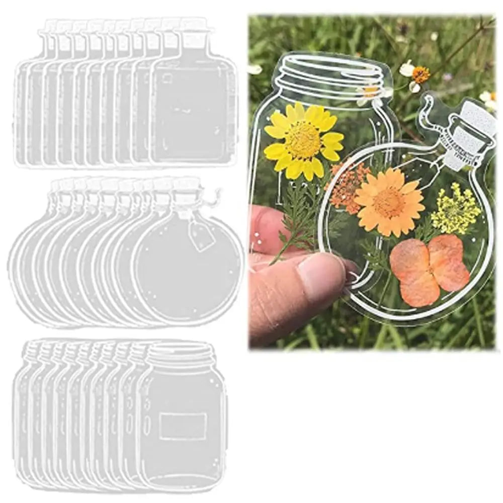A set of thirty clear glass jars filled with dried flowers used as DIY bookmarks.