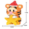 An orange and black tiger head figurine with a yellow star base made of micro building blocks.