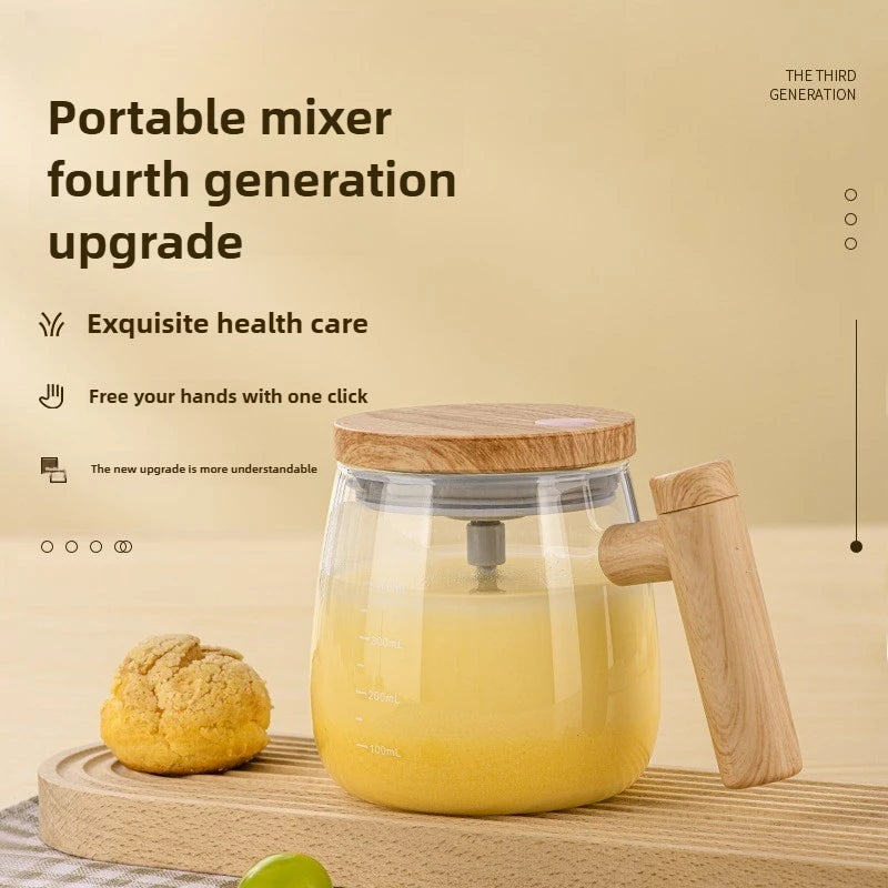 A clear glass mug with a yellow liquid and a wooden handle is shown on a light wooden surface.