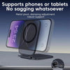 A clear magnetic phone holder device is shown supporting a smartphone on a surface.