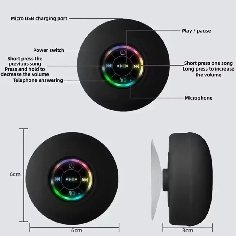 A black compact waterproof Bluetooth speaker with a suction cup mount and various control points visible.