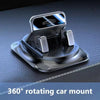 A black anti-slip silicone car phone mount with a metal style mount is shown rotating.