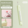 A light green needle threader tool with a spring green wire is shown next to its main material and usage examples.