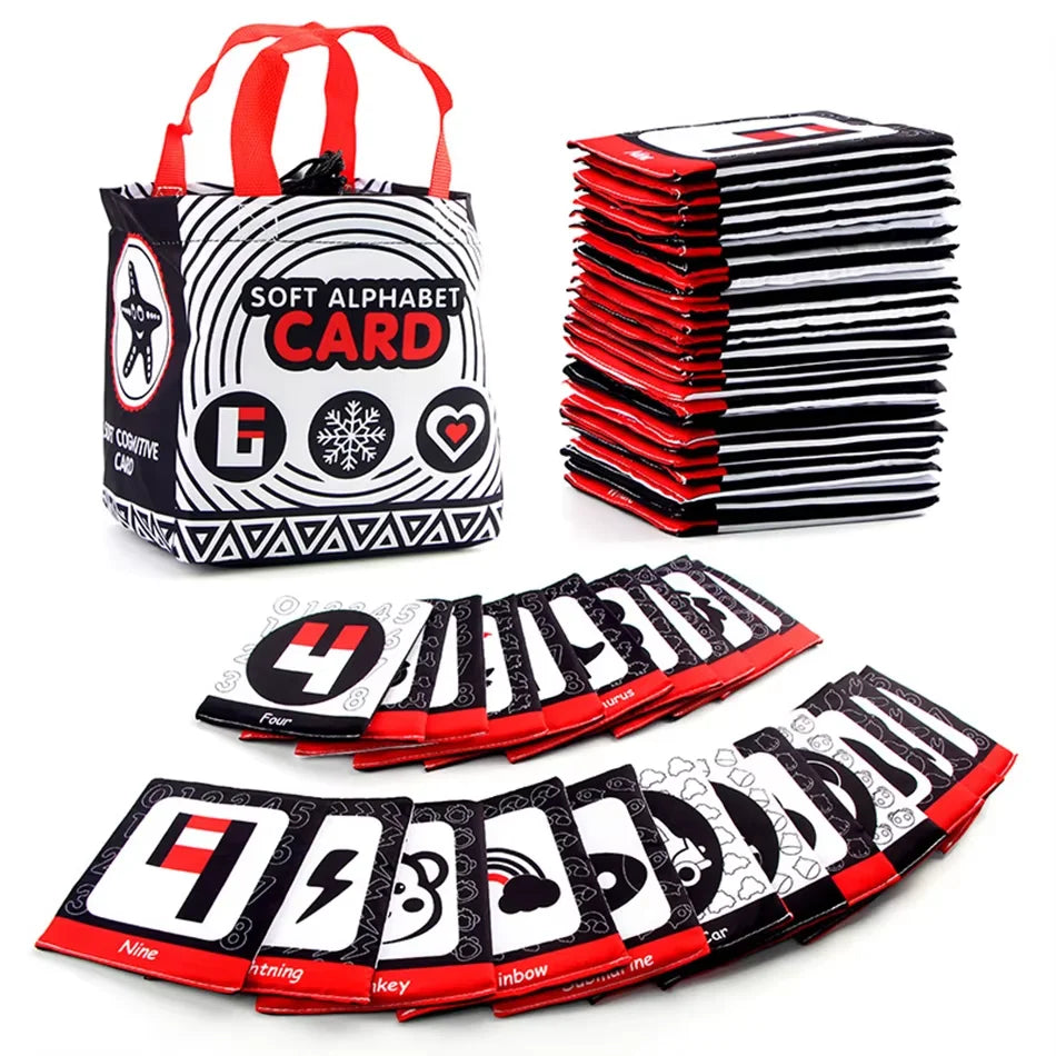 A set of baby soft cloth alphabet and number flash cards stored in a red and black fabric bag.