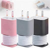 A set of pink and gray silicone charger protectors and cables organized in stacks.