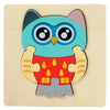 A wooden jigsaw puzzle featuring a stylized blue owl with large eyes and red chest details.