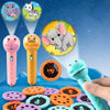 A colorful kids projector flashlight with various animal story cards and discs is shown against a blue starry background.