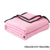 Pink quilted throw blanket folded and stacked, measuring 100cm x 150cm.