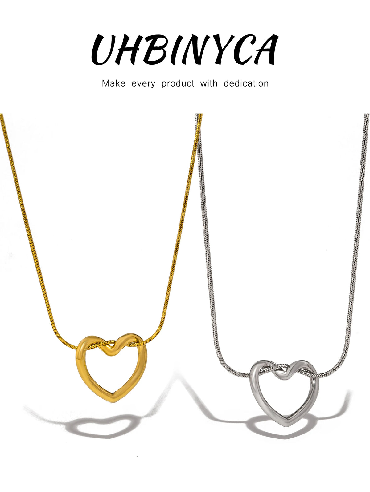 A dainty gold heart pendant necklace with a snake chain displayed against a white background.
