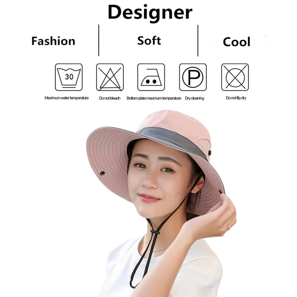 A woman models a pink bucket hat with a wide brim and black strap, demonstrating its fashion, soft, and cool features.