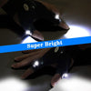 A hand wearing LED fingerless gloves with a built-in flashlight illuminating the surface.