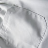 A close-up view of a white men's cargo jogger featuring a patch pocket on the side.