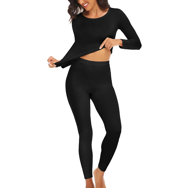 A woman wearing a black thermal underwear set with fleece lining.