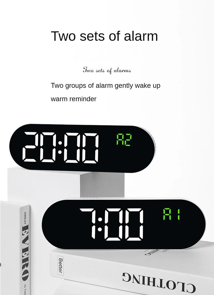 Two sets of alarm digital clocks showing 20:00 and 7:00 on white surfaces