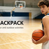 A young man wearing a white tank top and a blue backpack holds a basketball on a wooden court.