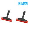 A set of two black tile gap filling and cleaning scrapers with red handles.