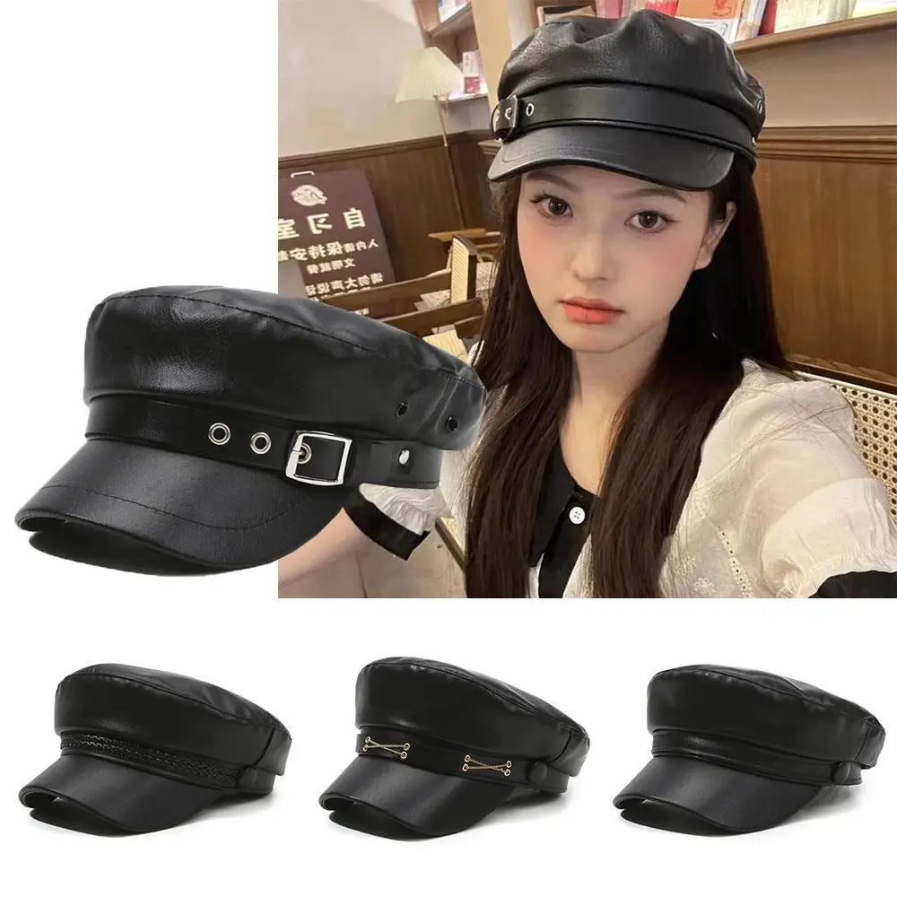 A close-up of a black PU leather beret hat worn by a woman.