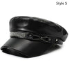 Black PU leather beret hat with a silver studded band and adjustable strap.