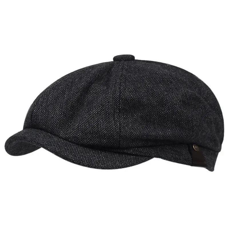A dark gray vintage retro newsboy cap with a textured fabric and a folded brim.