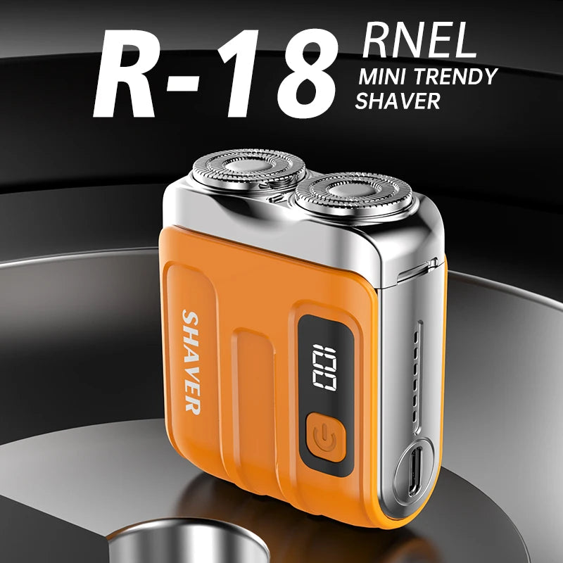 Una mini afeitadora R-18 naranja y plateada sobre una superficie oscura.