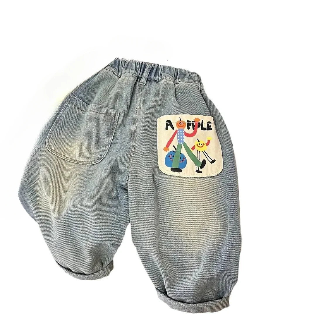 Light wash denim jeans with an elastic waist and a patch featuring cartoon people.