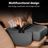 A gray car center console organizer with an armrest cushion and cup holder is shown being used in a vehicle interior.
