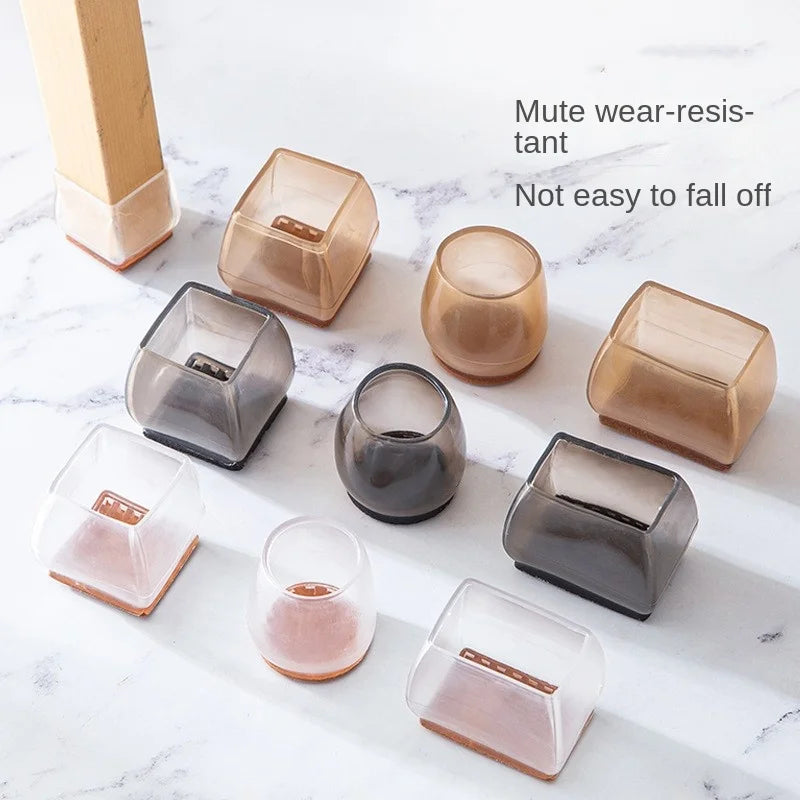 A collection of silicone furniture leg pads in various shapes and translucent colors resting on a white marble surface.