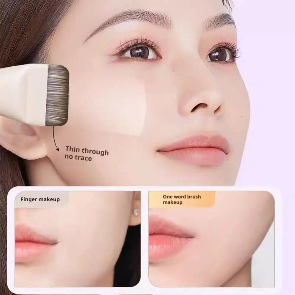 A close-up of a woman's face showing the application of a thin foundation using a professional flat brush for makeup.