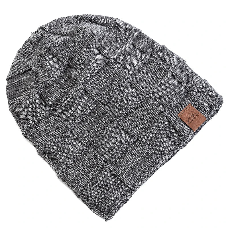 A gray knit beanie with a textured, diamond-patterned design.